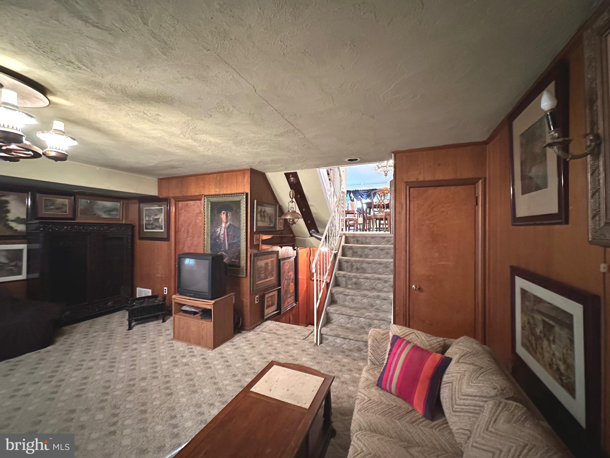 2740 Mower Street Philadelphia, PA 19152 - Photo 20 of 23 a living room with furniture lamp and a flat screen tv