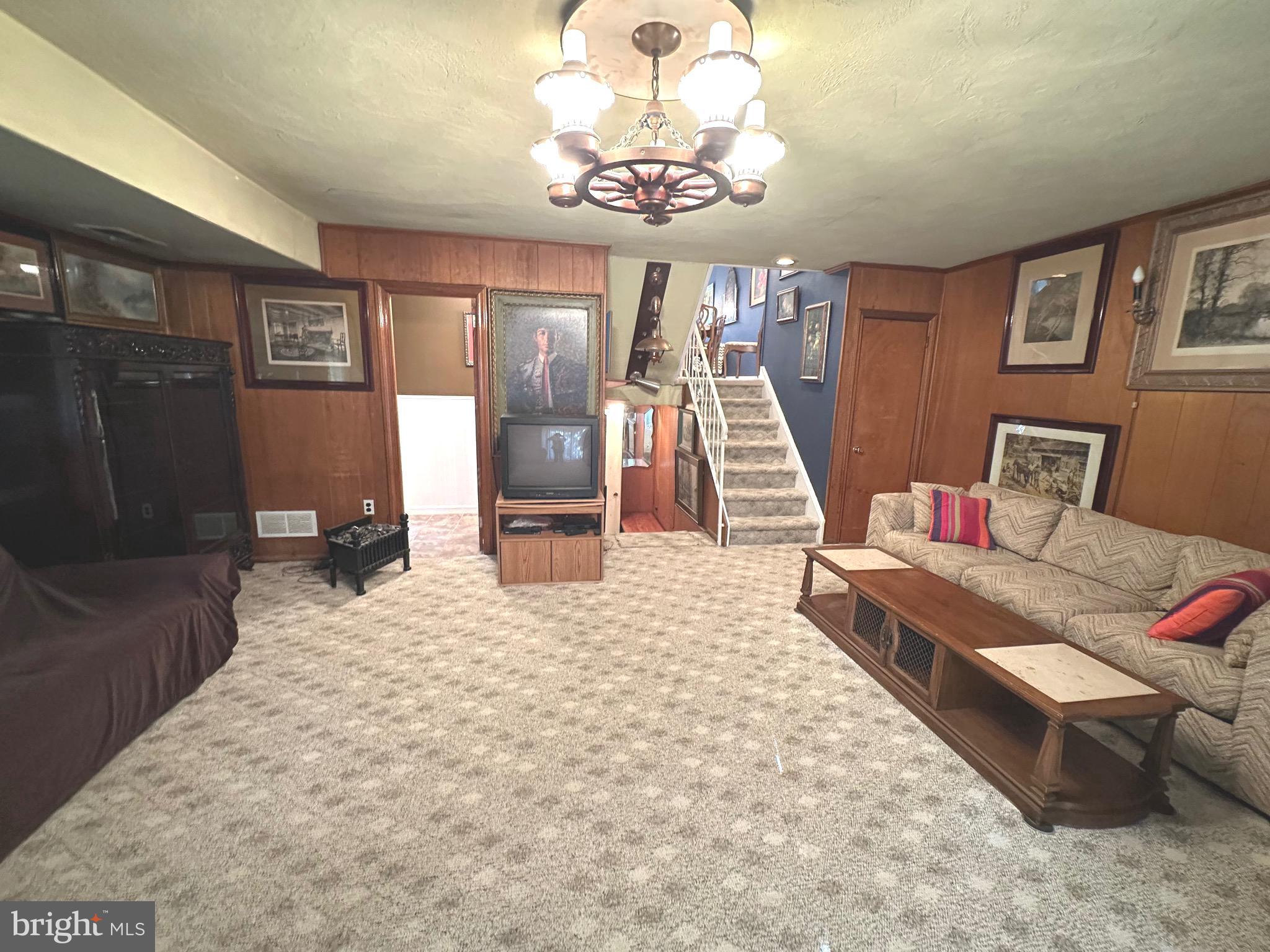 2740 Mower Street Philadelphia, PA 19152 - Photo 21 of 23 a bedroom with furniture and a chandelier