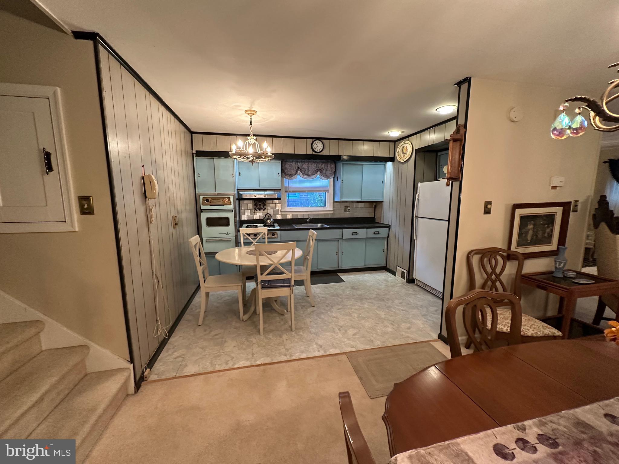 2740 Mower Street Philadelphia, PA 19152 - Photo 7 of 23 a kitchen with stainless steel appliances kitchen island granite countertop a refrigerator and microwave