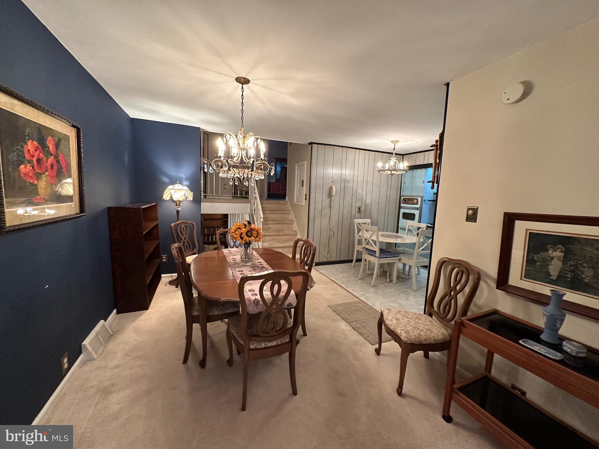 2740 Mower Street Philadelphia, PA 19152 - Photo 8 of 23 a dining room with furniture a chandelier and window
