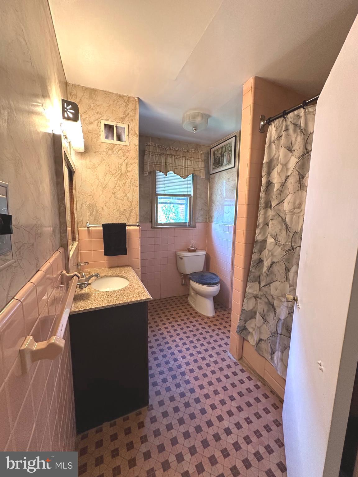 2740 Mower Street Philadelphia, PA 19152 - Photo 10 of 23 a living room with a toilet and a shower curtain
