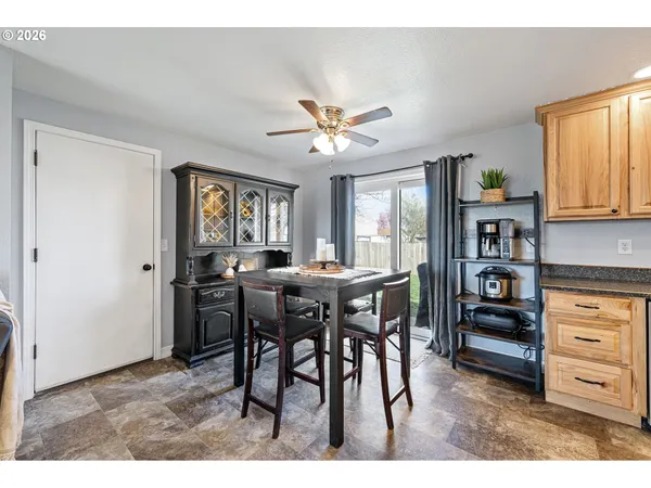 a view of a dining room with furniture and window