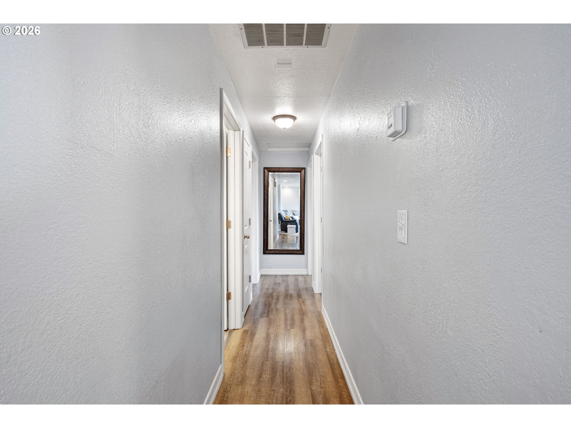 86 East 2nd Street Halsey, OR 97348 - Photo 19 of 36 a view of a hallway with wooden floor