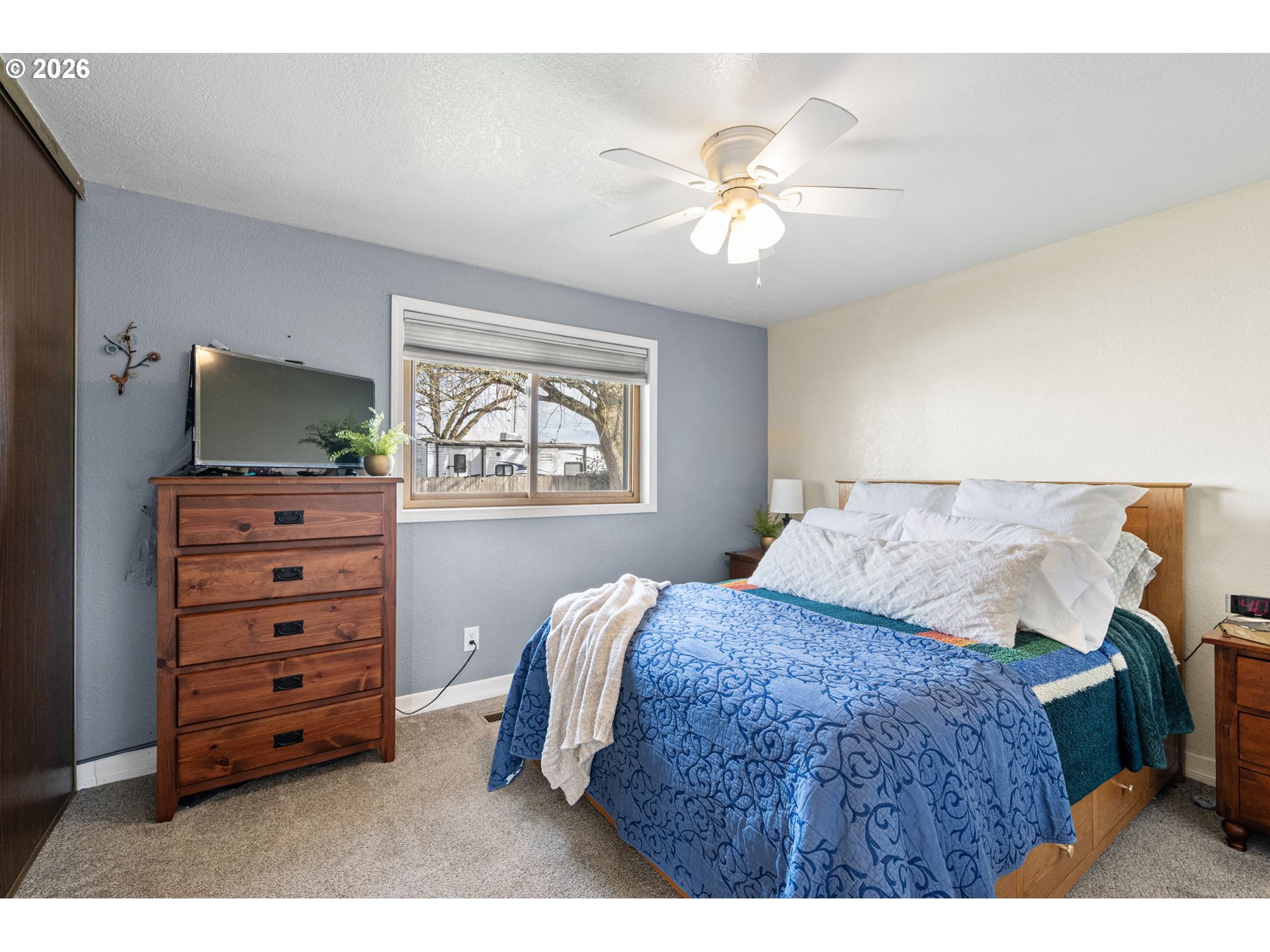 86 East 2nd Street Halsey, OR 97348 - Photo 20 of 36 a bedroom with a bed and a dresser