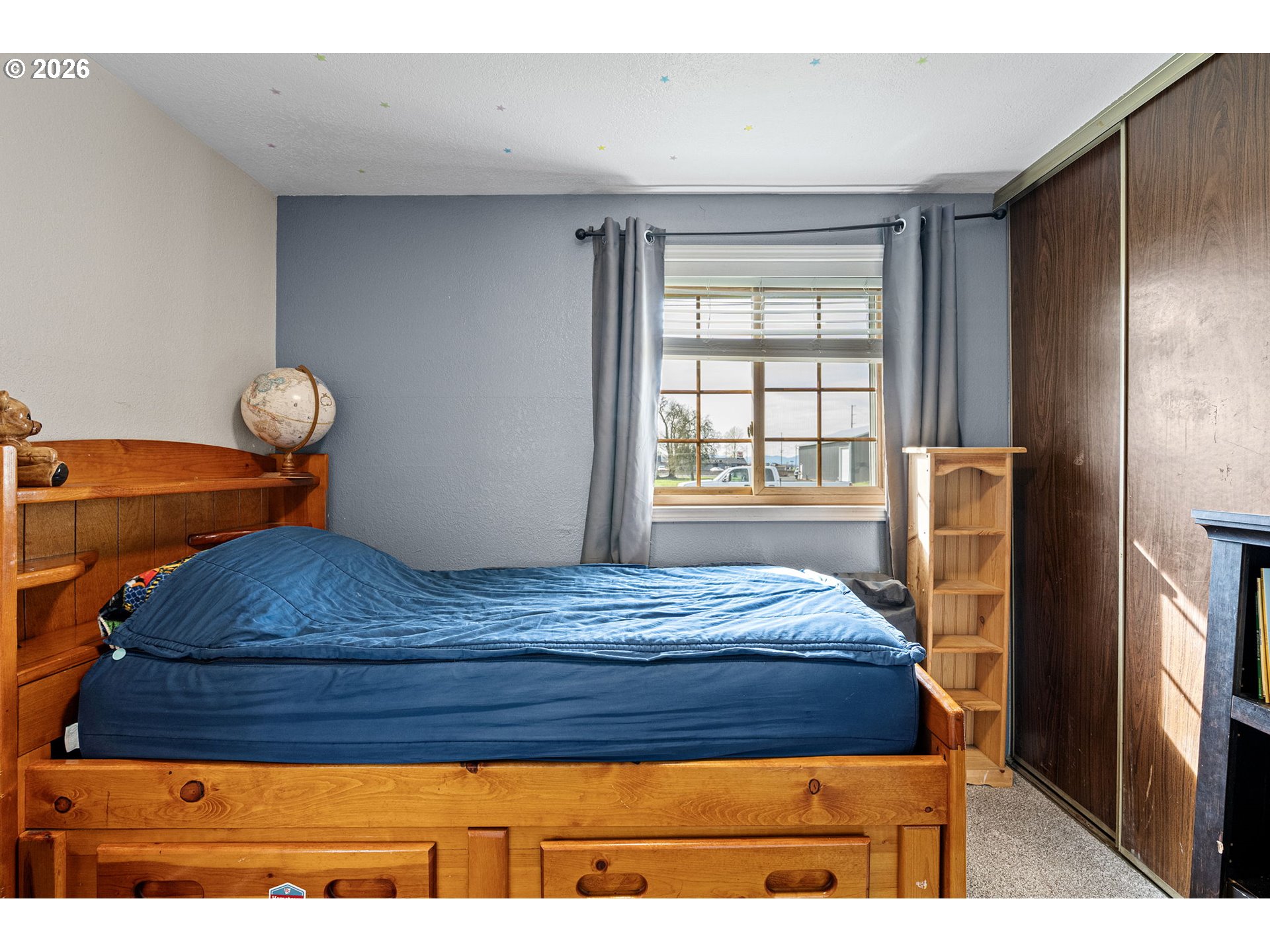 86 East 2nd Street Halsey, OR 97348 - Photo 24 of 36 a bedroom with a bed and window