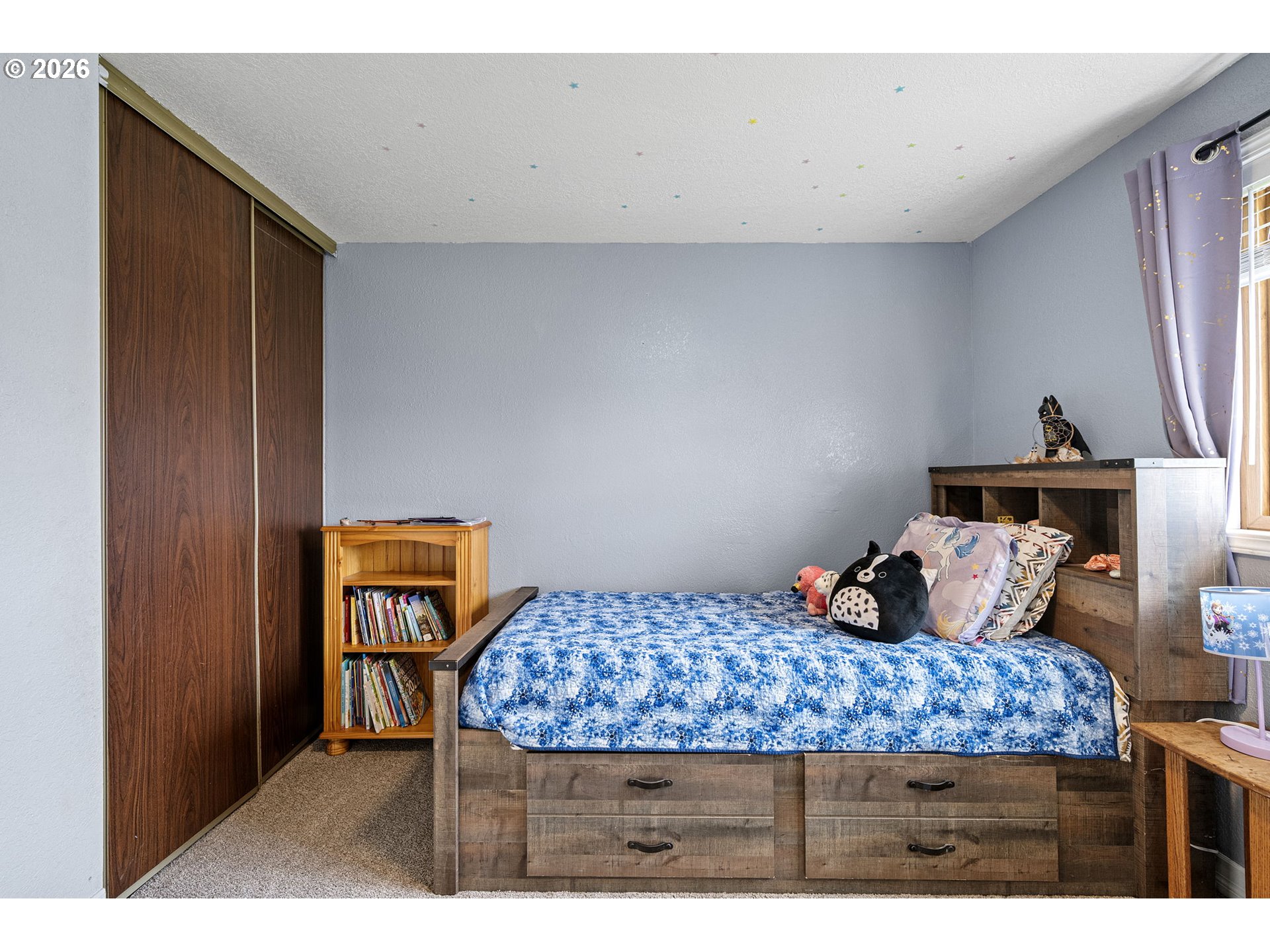 86 East 2nd Street Halsey, OR 97348 - Photo 26 of 36 a bedroom with a bed and wooden floor