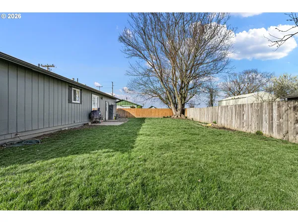 a backyard of a house with lots of green space