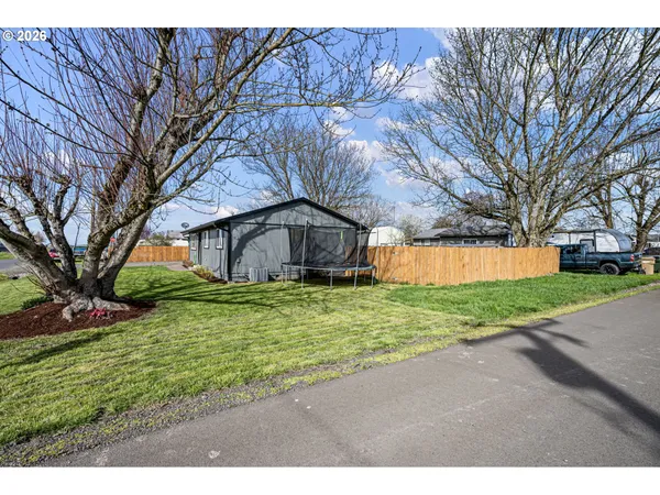 a backyard of a house with lots of green space