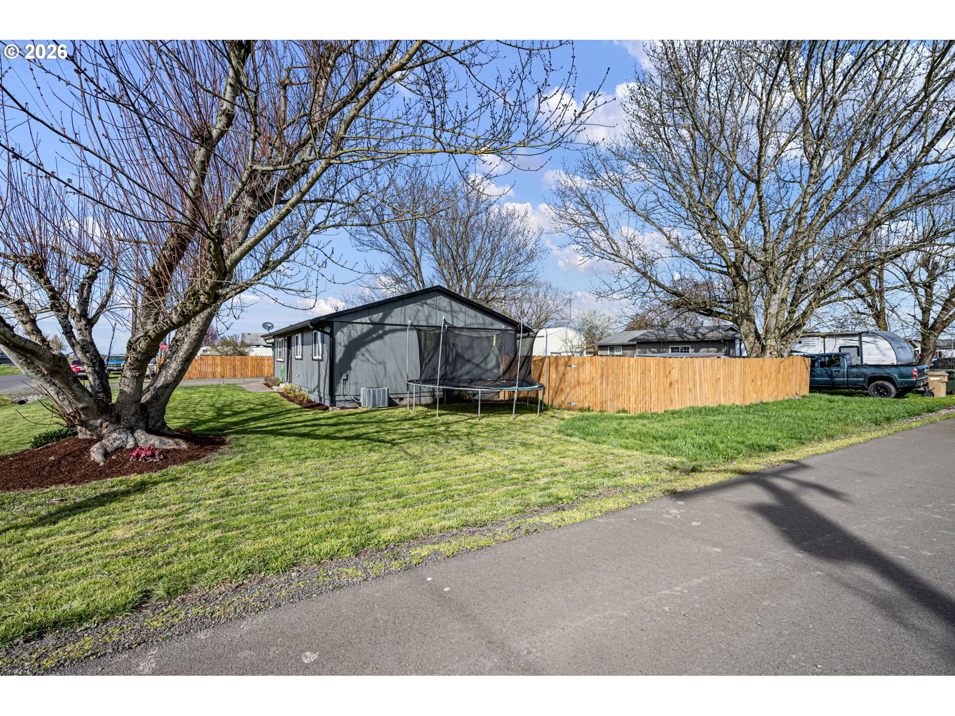 86 East 2nd Street Halsey, OR 97348 - Photo 3 of 36 a backyard of a house with lots of green space