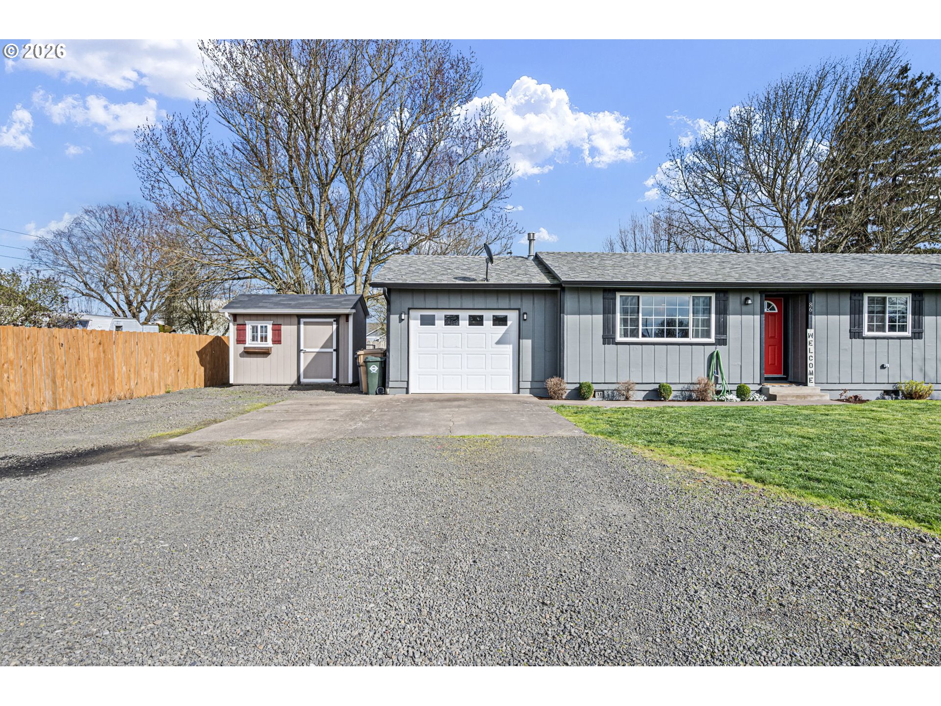 86 East 2nd Street Halsey, OR 97348 - Photo 34 of 36 a front view of a house with a yard and garage