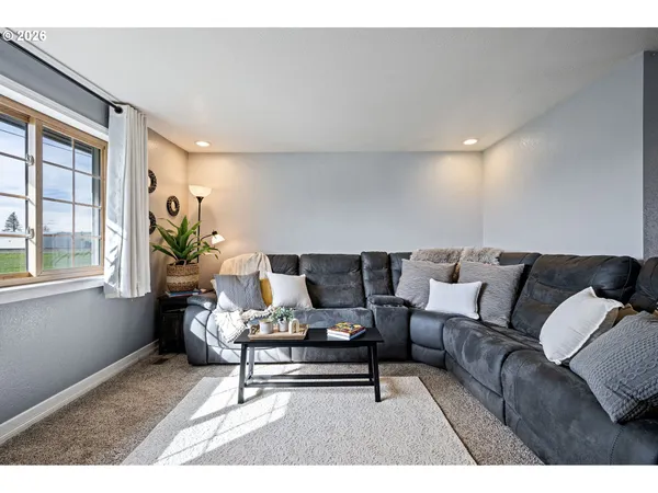 a living room with furniture and windows