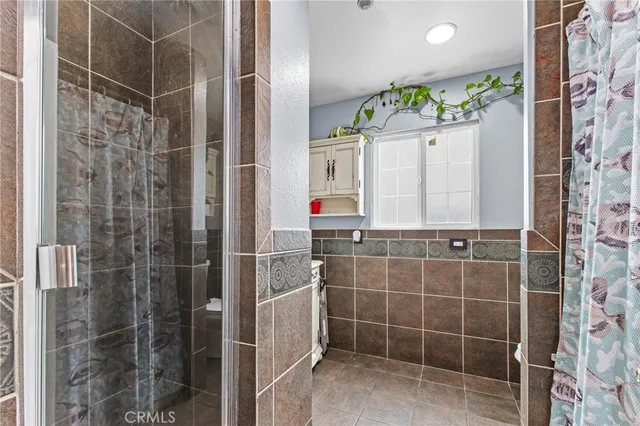 a bathroom with a shower and a sink