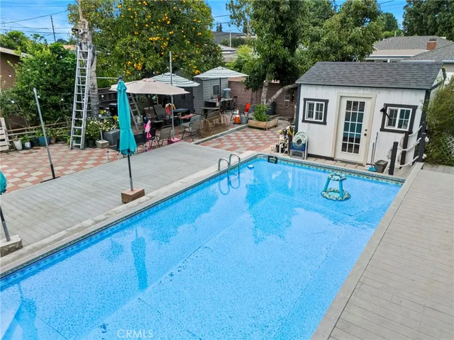 swimming pool view with a outdoor seating