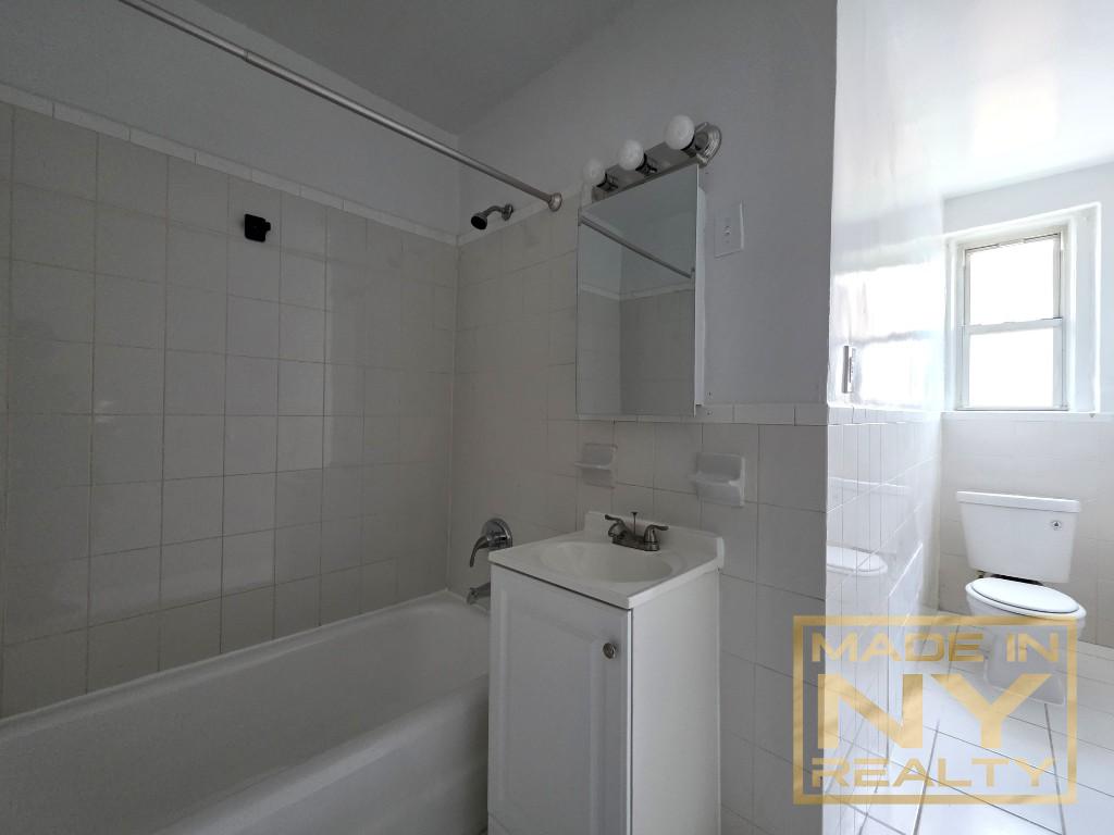 122-20 Ocean Prom, Unit 5B Queens, NY 11694 - Photo 4 of 4 a bathroom with a bathtub a toilet and a shower