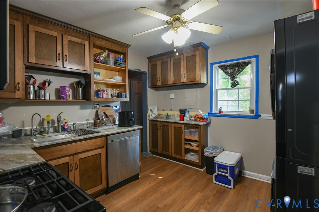49 Harvard Road Portsmouth, VA 23701 - Photo 6 of 9 Kitchen featuring wood-finish flooring, wood cabin