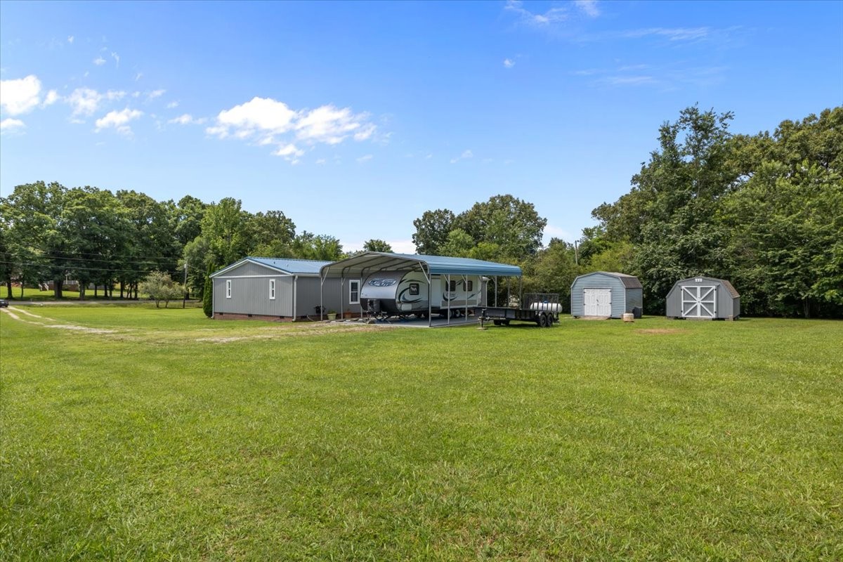1112 Garners Creek Road Dickson, TN 37055 - Photo 45 of 57 a front view of a house with a garden