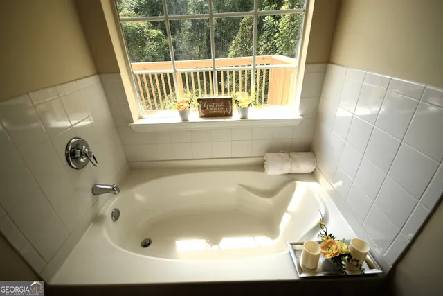 a bathroom with a sink double vanity and a mirror