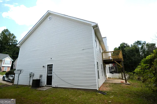 a view of a house with a street