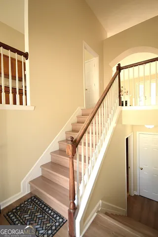 a view of staircase with wooden floor and staircase