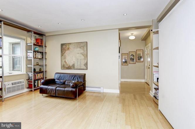 3100 Connecticut Avenue Northwest, Unit 419 Washington, DC 20008 - Photo 12 of 15 a living room with furniture and a wooden floor