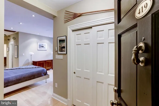 a bedroom with a bed and a closet