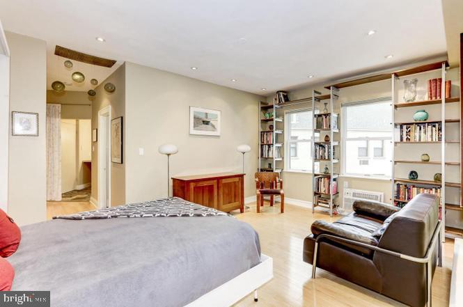 3100 Connecticut Avenue Northwest, Unit 419 Washington, DC 20008 - Photo 5 of 15 a bedroom with furniture and a large window