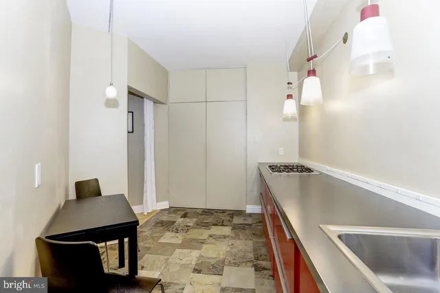 a bathroom with a bathtub and shower