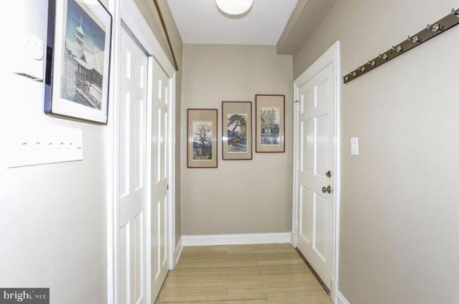 3100 Connecticut Avenue Northwest, Unit 419 Washington, DC 20008 - Photo 10 of 15 a view of a hallway with wooden floor and windows