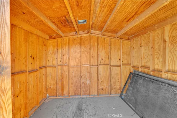 a view of a room with wooden walls