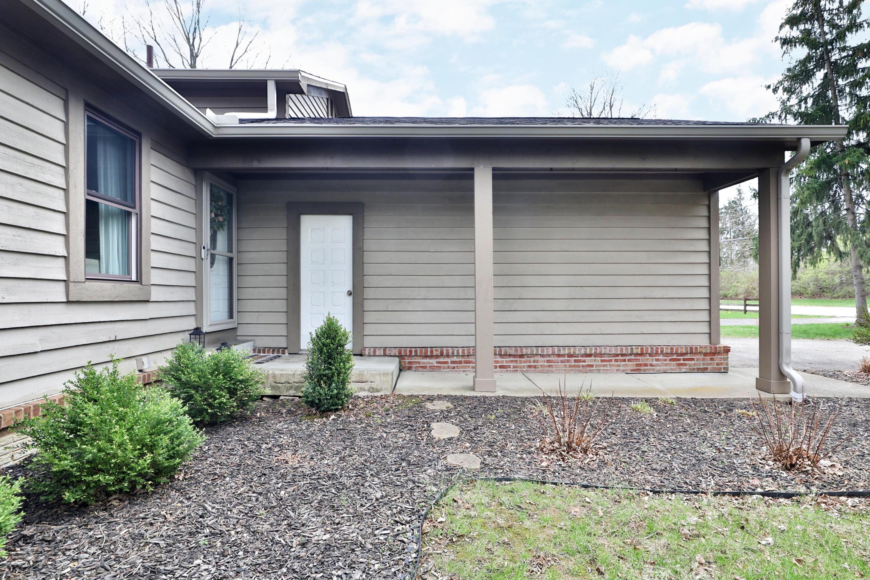 7044 Linworth Road Columbus, OH 43235 - Photo 4 of 48 Covered front porch with garage access