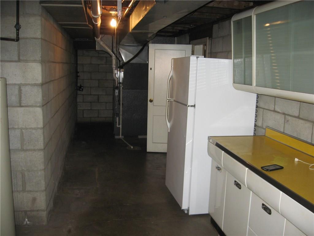 160 Braddock Rd Avenue Mount Pleasant, PA 15666 - Photo 23 of 24 Workspace in laundry area, a spare refrigerator for the holiday feasts. Look at the well maintained metal classic kitchen cabinets.