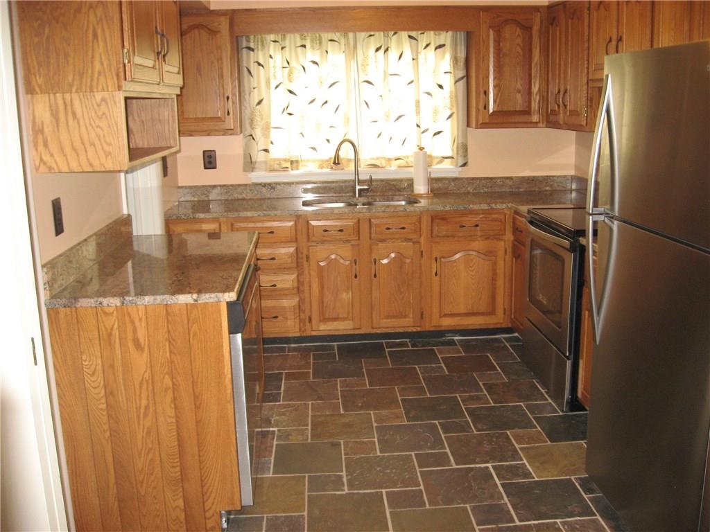 160 Braddock Rd Avenue Mount Pleasant, PA 15666 - Photo 10 of 24 Newer kitchen, all stainless steel appliances, slate floors and granite countertops.