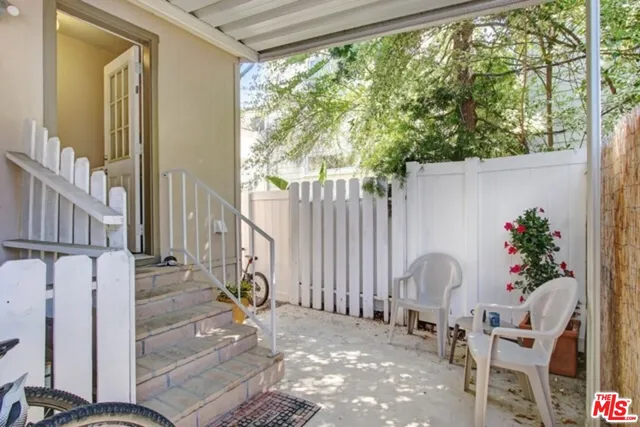 a view of swimming pool with chairs