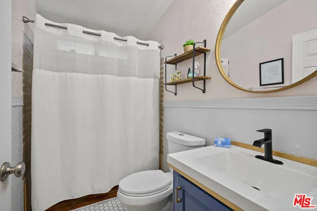 a utility room with sink dryer and washer