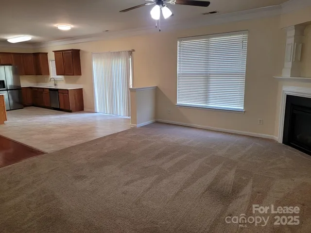 a view of kitchen and kitchen with furniture