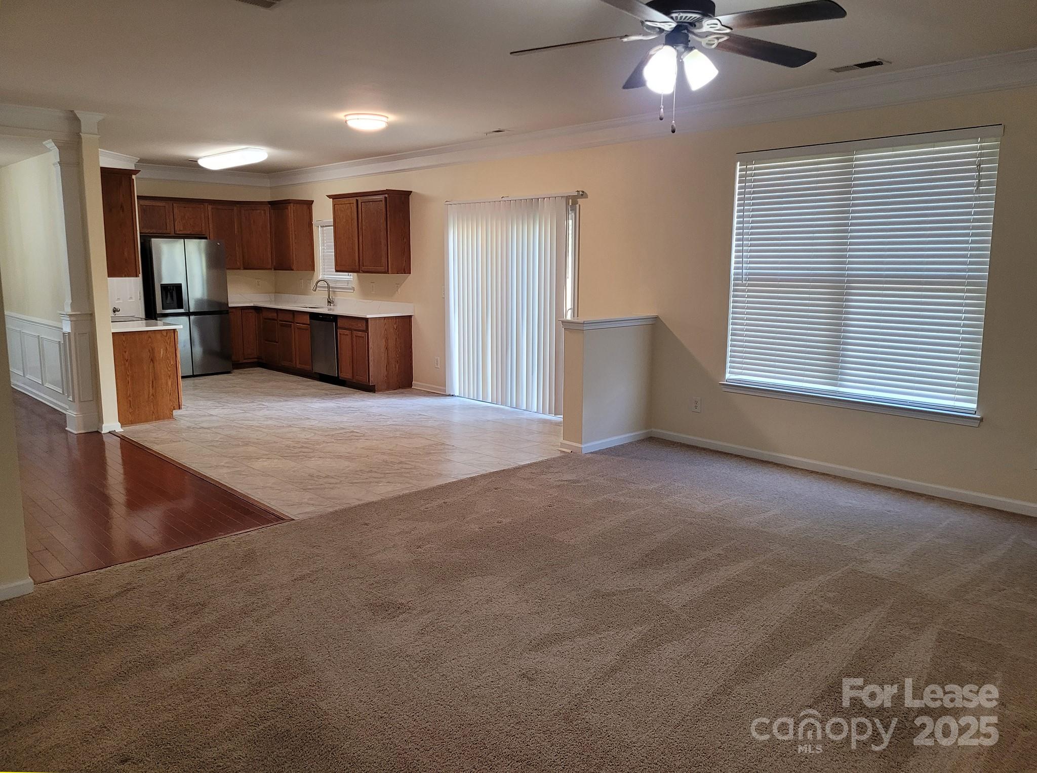 13008 Rothe House Road Charlotte, NC 28273 - Photo 18 of 26 a view of an empty room with window and cabinet