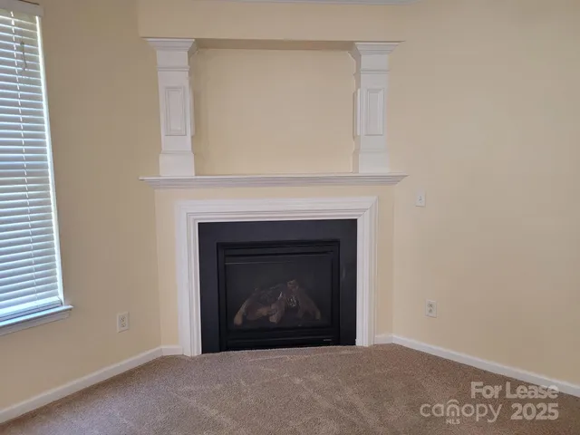 a living room with a fireplace