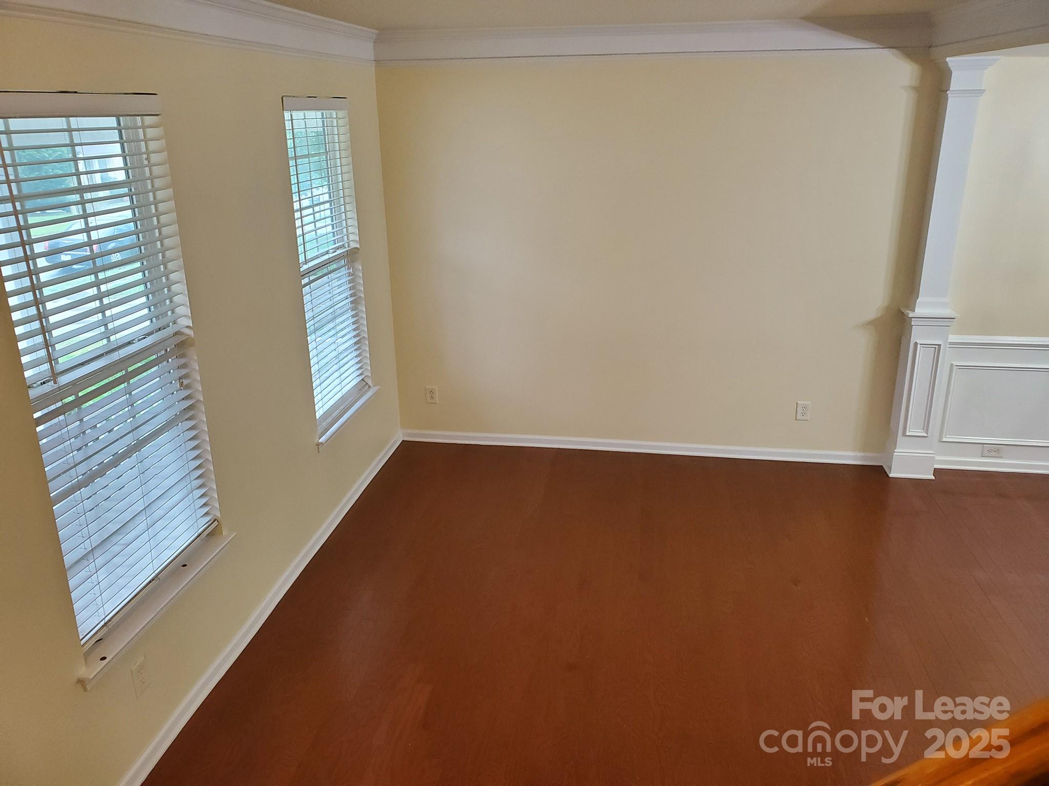 13008 Rothe House Road Charlotte, NC 28273 - Photo 4 of 26 an empty room with windows