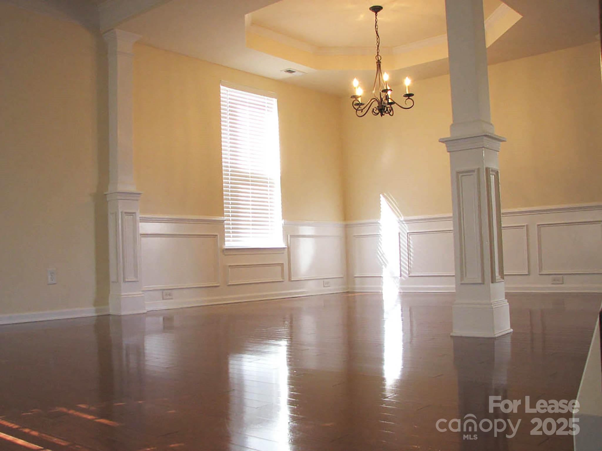 13008 Rothe House Road Charlotte, NC 28273 - Photo 5 of 26 a view of a livingroom with wooden floor and a window