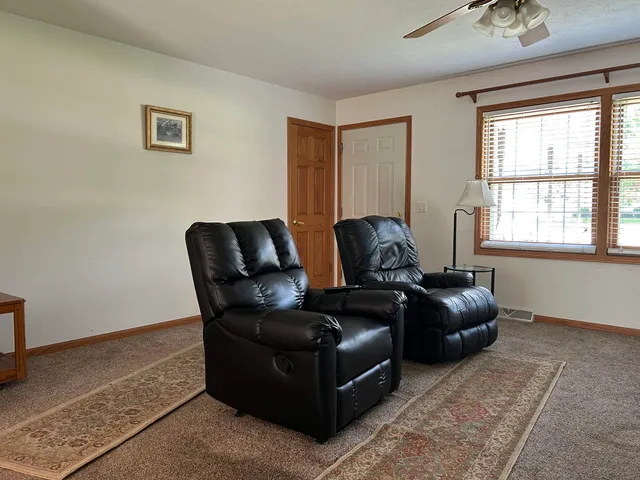 a living room with furniture and a window