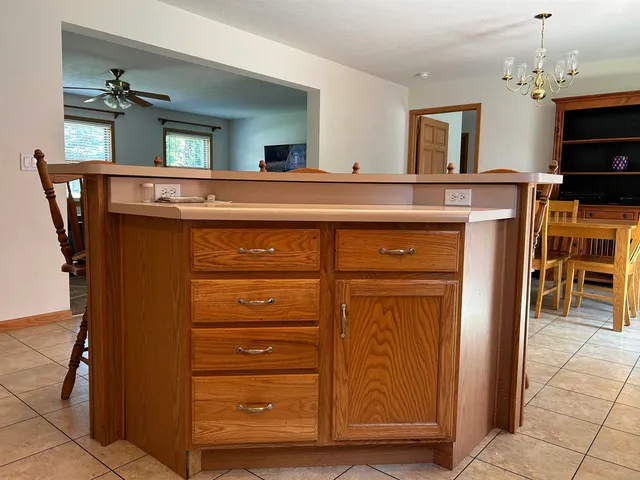 a view of kitchen with cabinets and wooden floor
