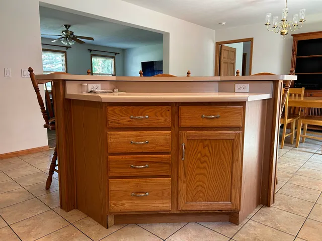 a view of kitchen with cabinets