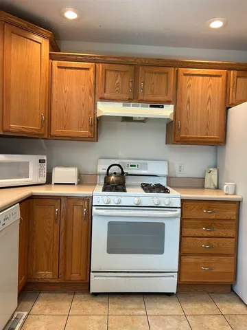 a kitchen with appliances cabinets and a sink