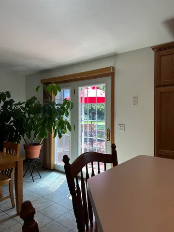 a workspace with furniture window and wooden floor