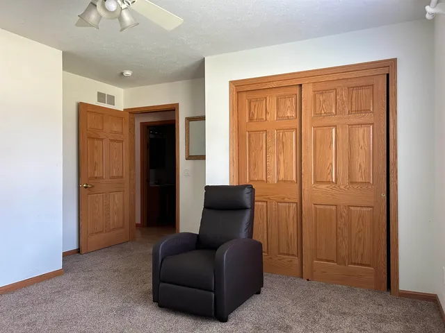 a hallway with furniture and a window
