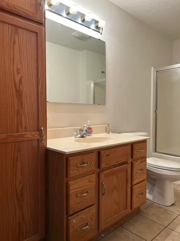 a bathroom with a sink toilet and vanity