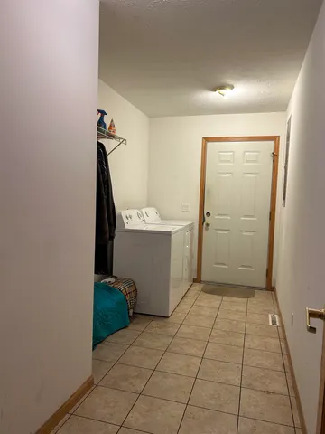 a view of a storage & utility room with a sink