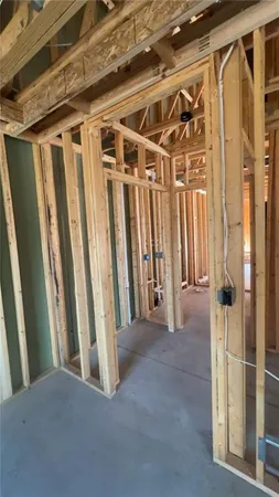 a view of an empty room with wooden walls