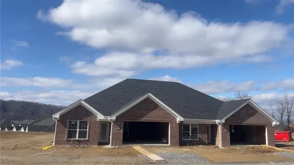 a front view of a house with yard