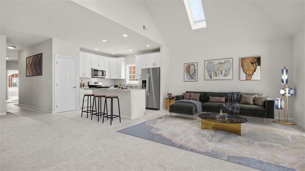 300 River Rdg Court Baden, PA 15005 - Photo 6 of 28 a living room with furniture and kitchen view